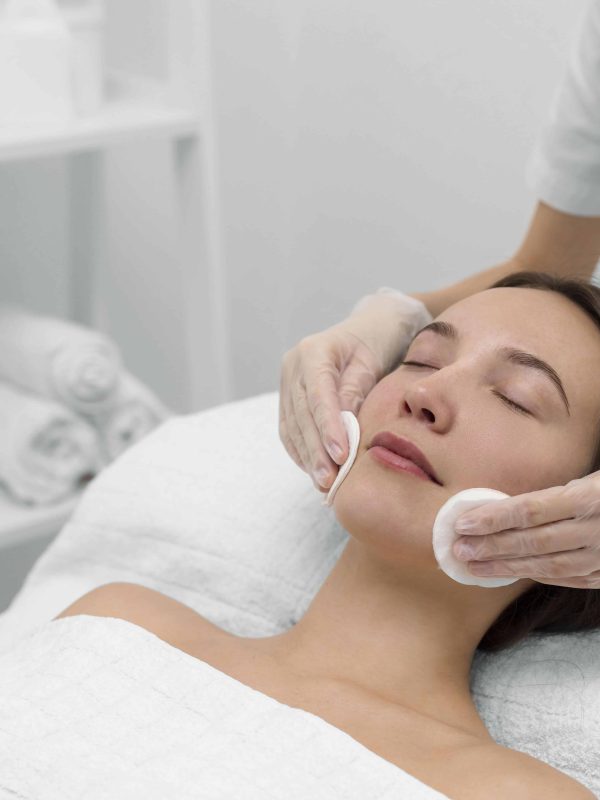 beautician-with-female-client-salon-face-care-routine beautician-with-female-client-salon-face-care-routine